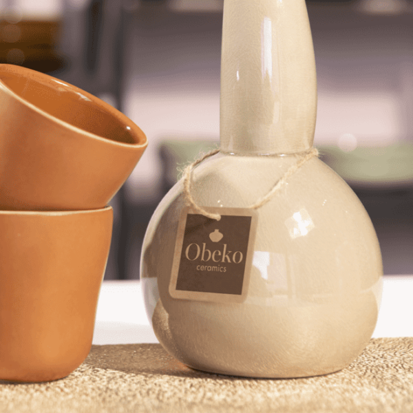 Brown logo on kraft paper hand tag for ceramics business