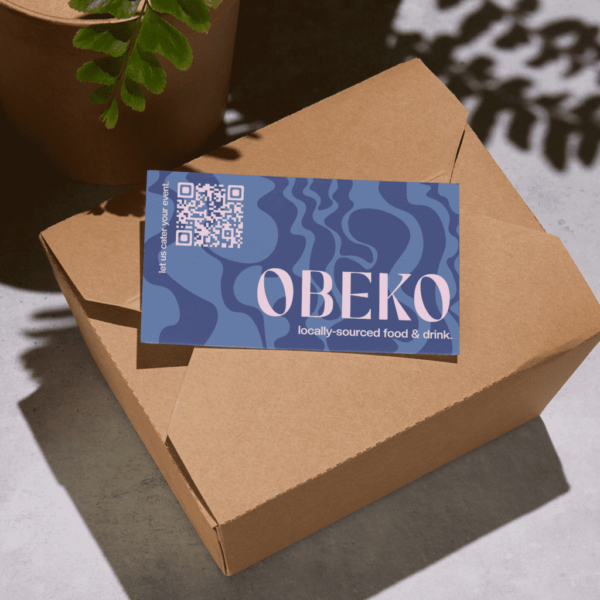 Purple logo printed on postcard