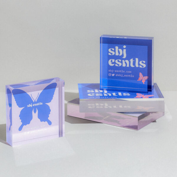 Purple logo printed on business card and acrylic stand