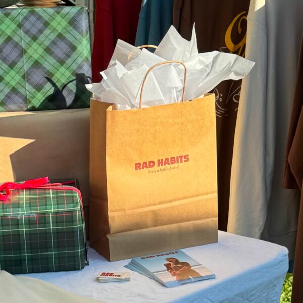 Red logo printed on a kraft paper bag