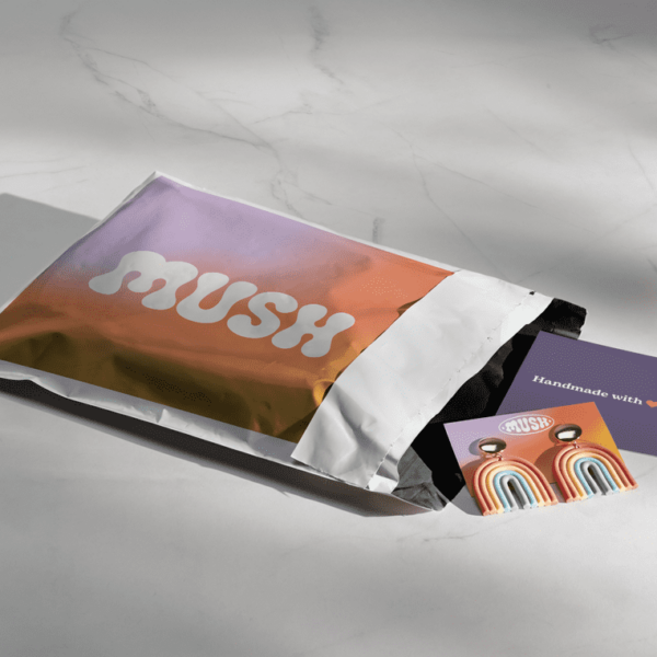 White logo printed on colorful mailer