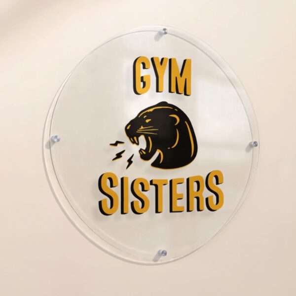 Yellow logo printed on acrylic sign