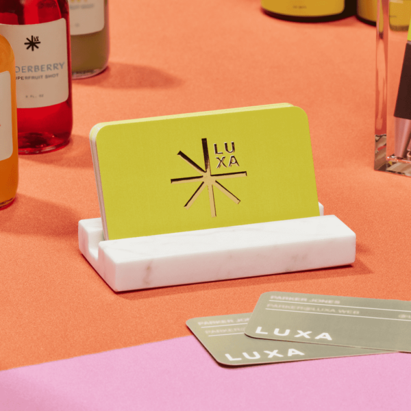 Golden yellow logo on a yellow business card