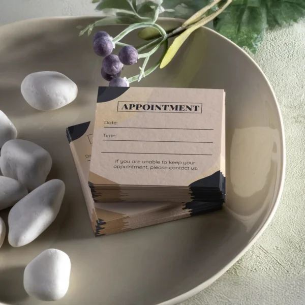 A stack of appointment cards in a bowl, business card types