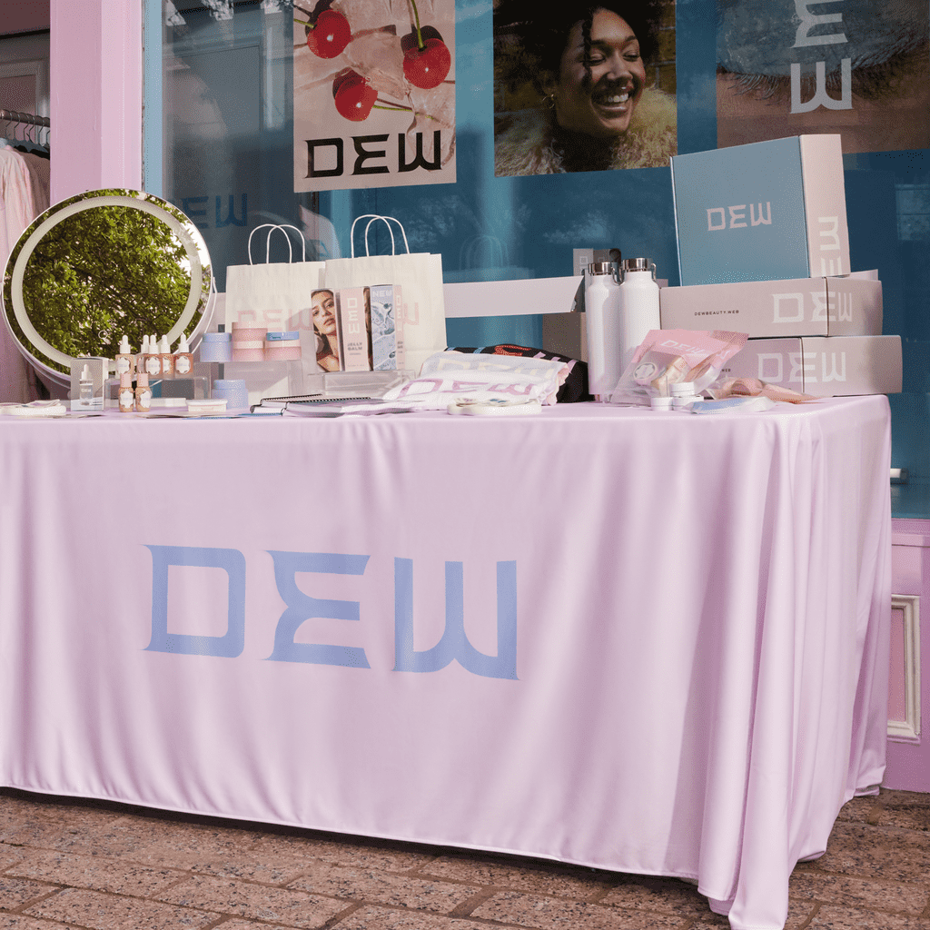 A stall for a brand with pastel pink and blue branding