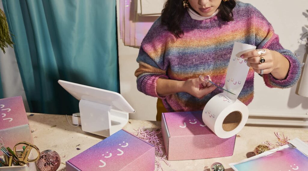 A small business owner with custom packaging