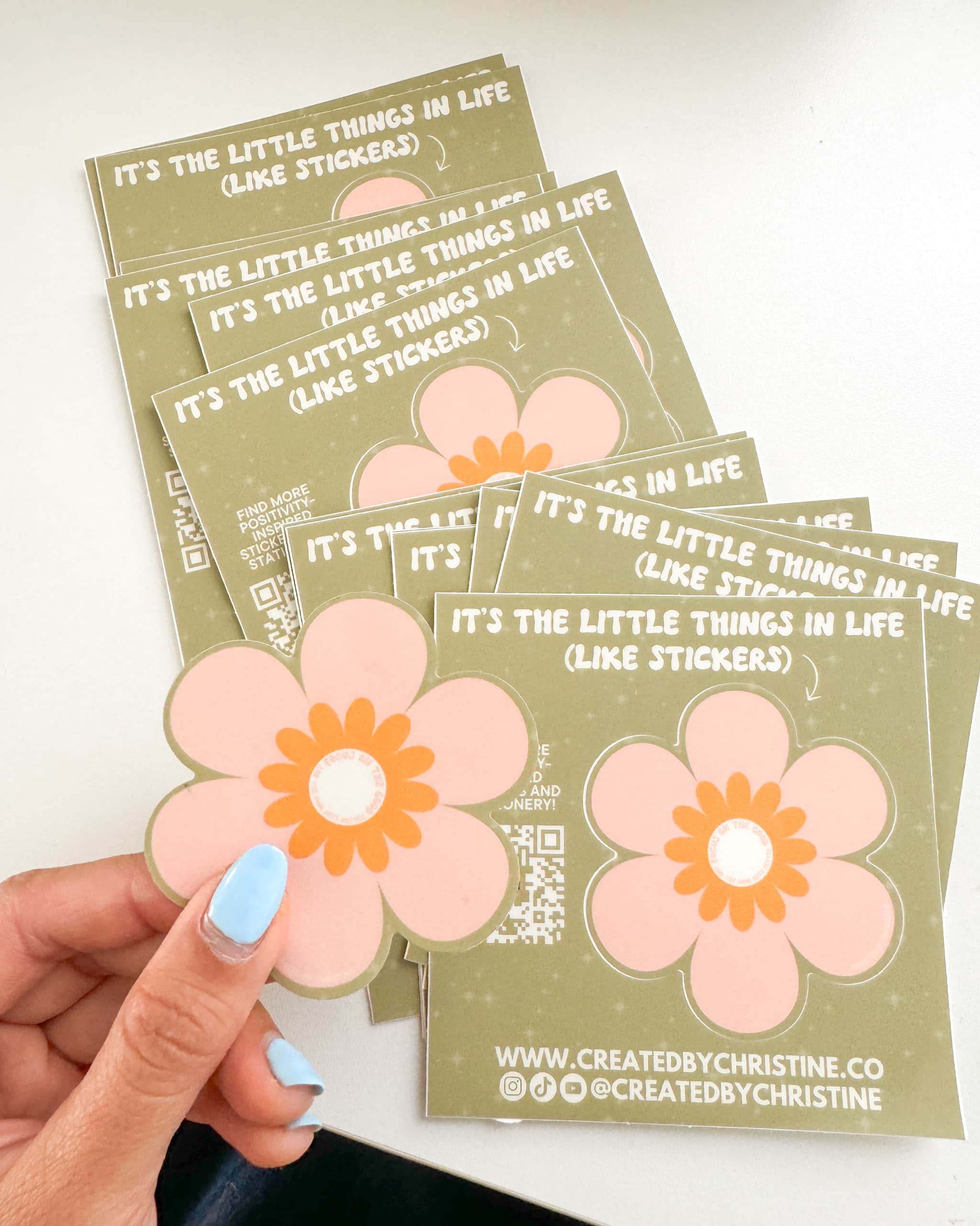 Green and pink flower stickers with text that reads “It’s the little things in life.”