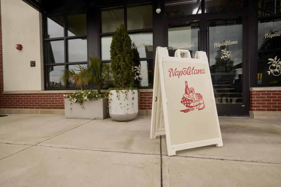 Branded Signicade sign outside of the Napoletana store, uses brand logo, imagery and colors