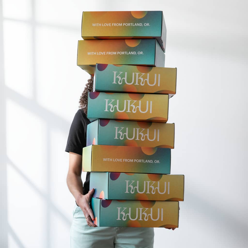 A brand logo printed on colorful mailer boxes packaging