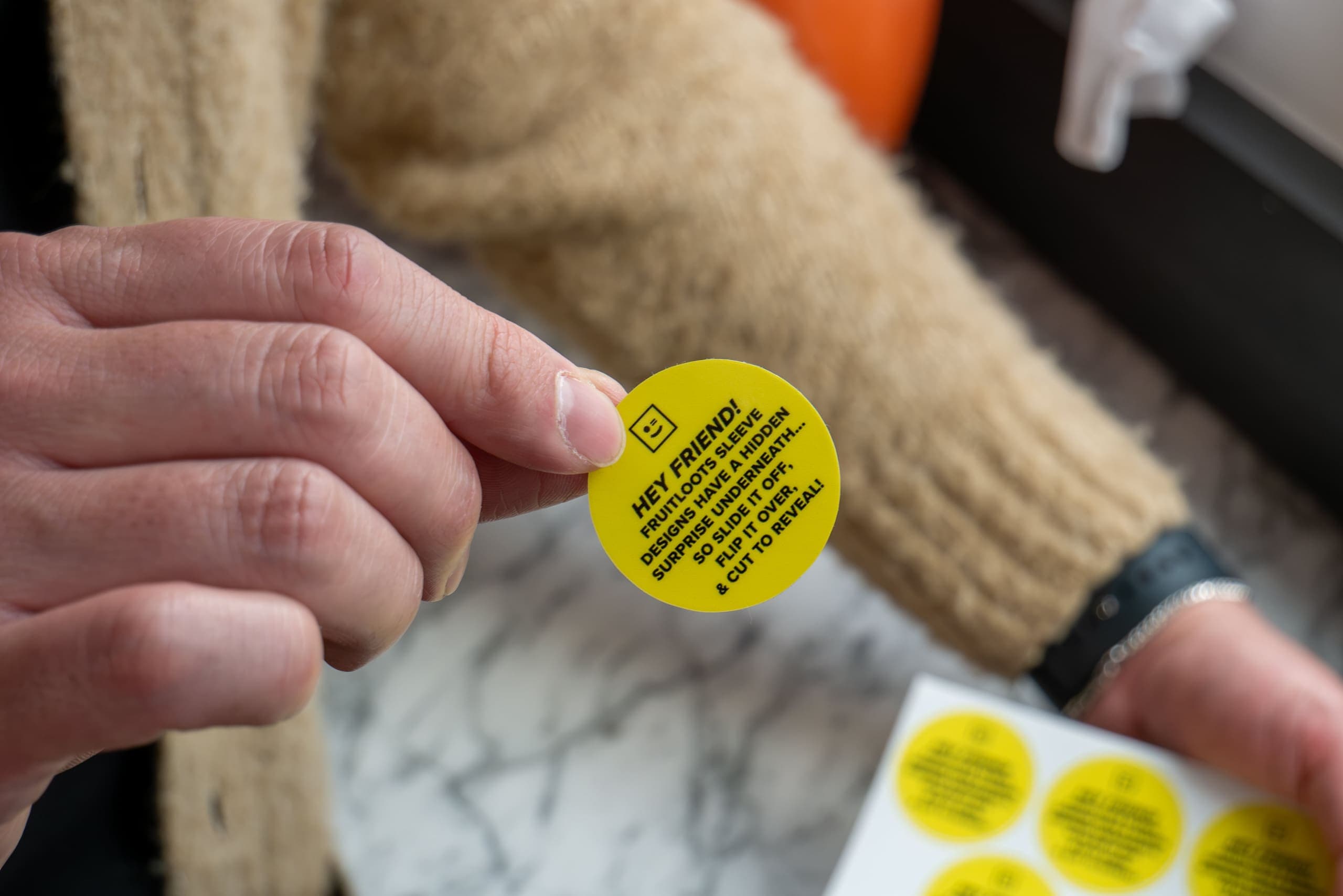 FRUITLOOTS custom stickers using the brand colors and the copy aligned with the brand tone of voice outlined in the brand style guide