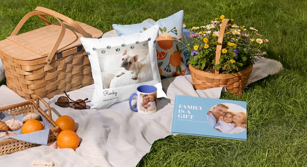 picnic scene set up with custom printed pillow, mug and photo book