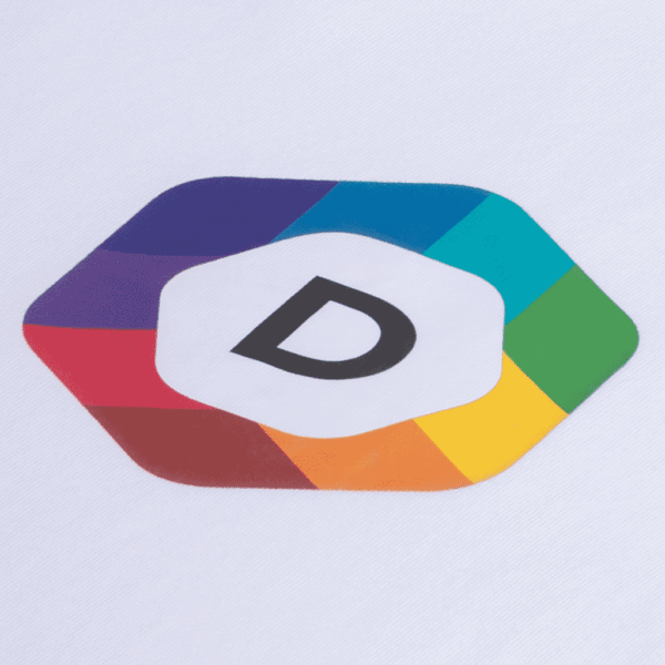A close-up of a multi-colored brand logo printed on white fabric using heat transfer logo printing method