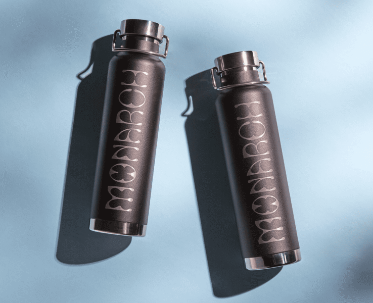 Metallic branded water bottle with the brand logo &ldquo;Monarch&rdquo; engraved onto it