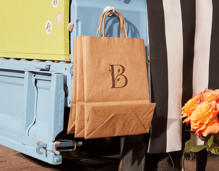 Brand logo printed on a kraft paper bag