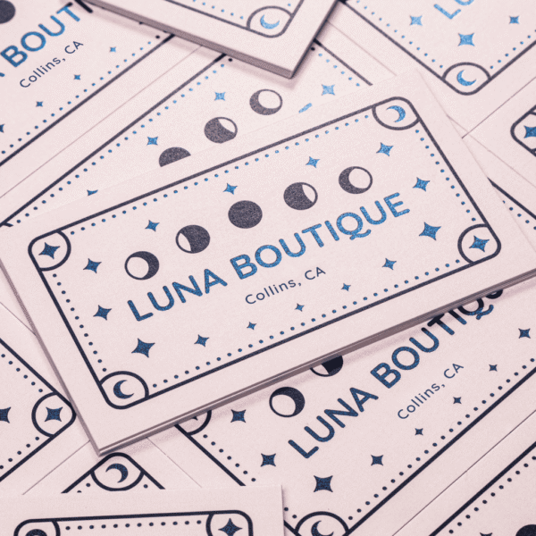 Business cards with the brand logo printed on the front side using foil stamping