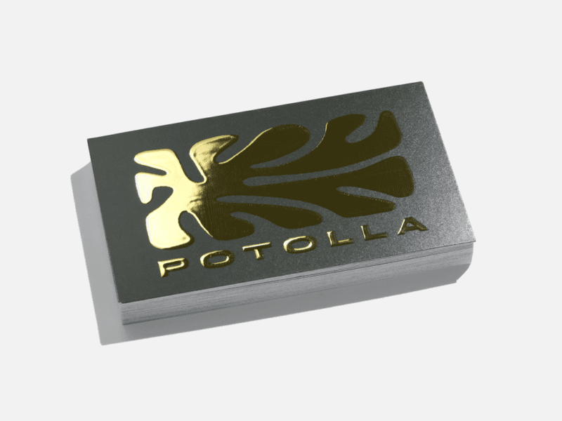Business card with the brand logo printed on the front side using raised golden foil