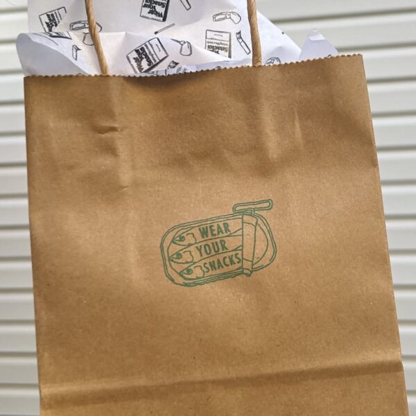 Small business Wear Your Snacks using a pictorial logo of socks in a tin