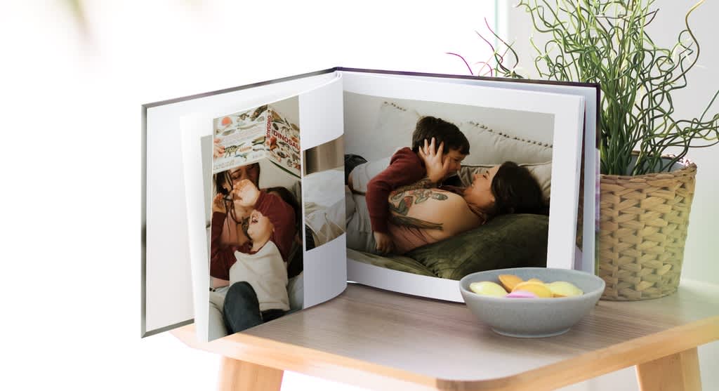 Asymmetric family photo book layout with photos of a mother and son and lots of white space