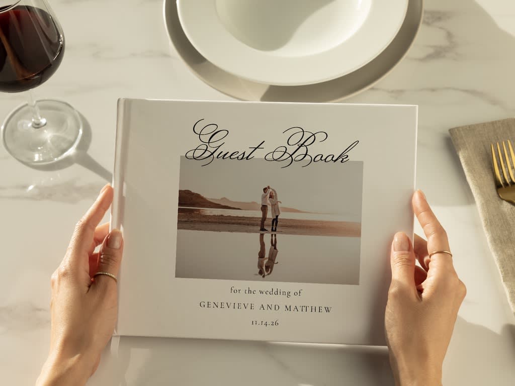 Cover photo of a couple on the beach on a wedding guest photo book
