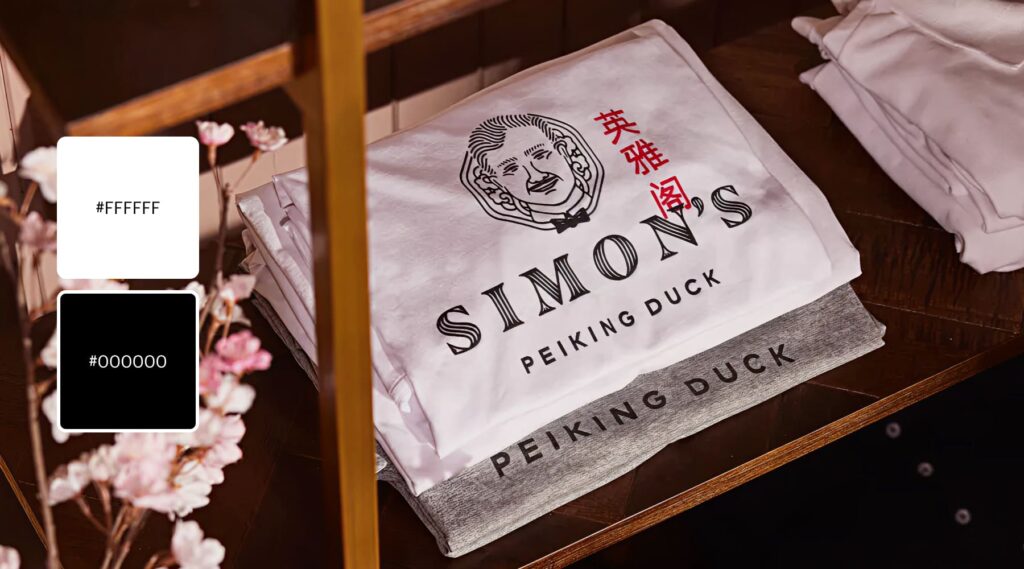 A black and white logo for Simon’s Peking Duck with a phrase in Chinese accented in red