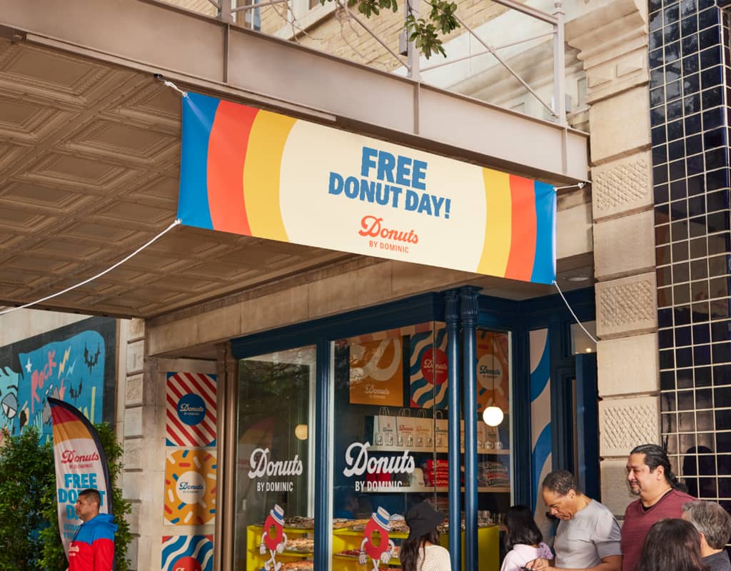 Red, yellow and blue donut shop outdoor banner