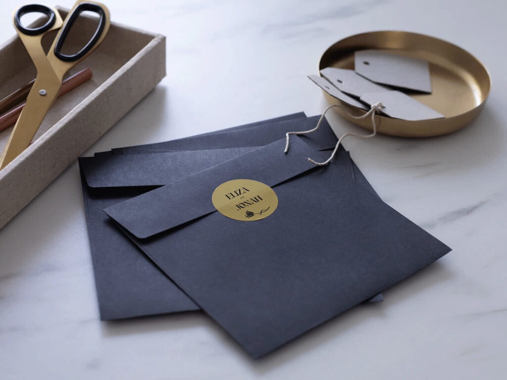 Navy save-the-date envelope with Eliza and Jonah sticker