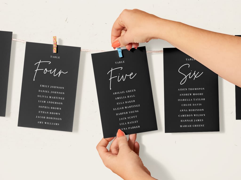 Guests’ table numbers hung on a washing line, wedding sign ideas