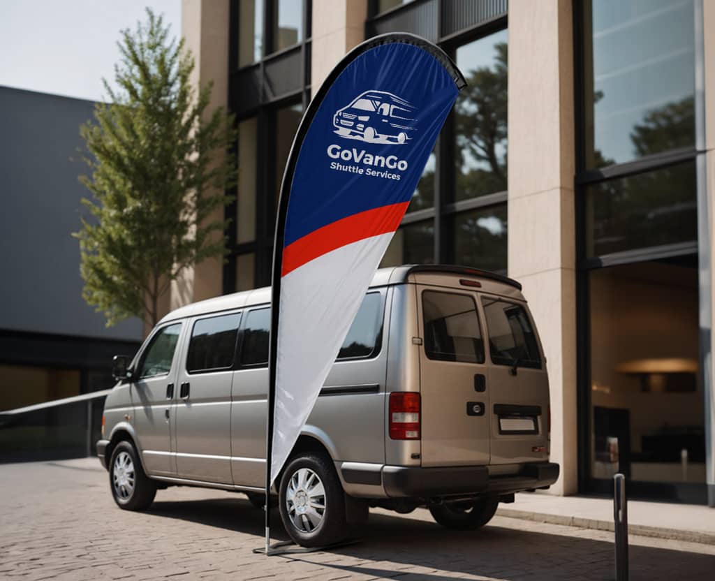 Van shuttle services company teardrop flag outside next to a van