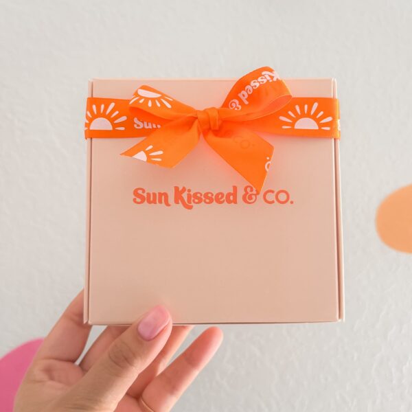 Small business wordmark logo, Sun Kissed & Co, with playful embellishments and vibrant color.