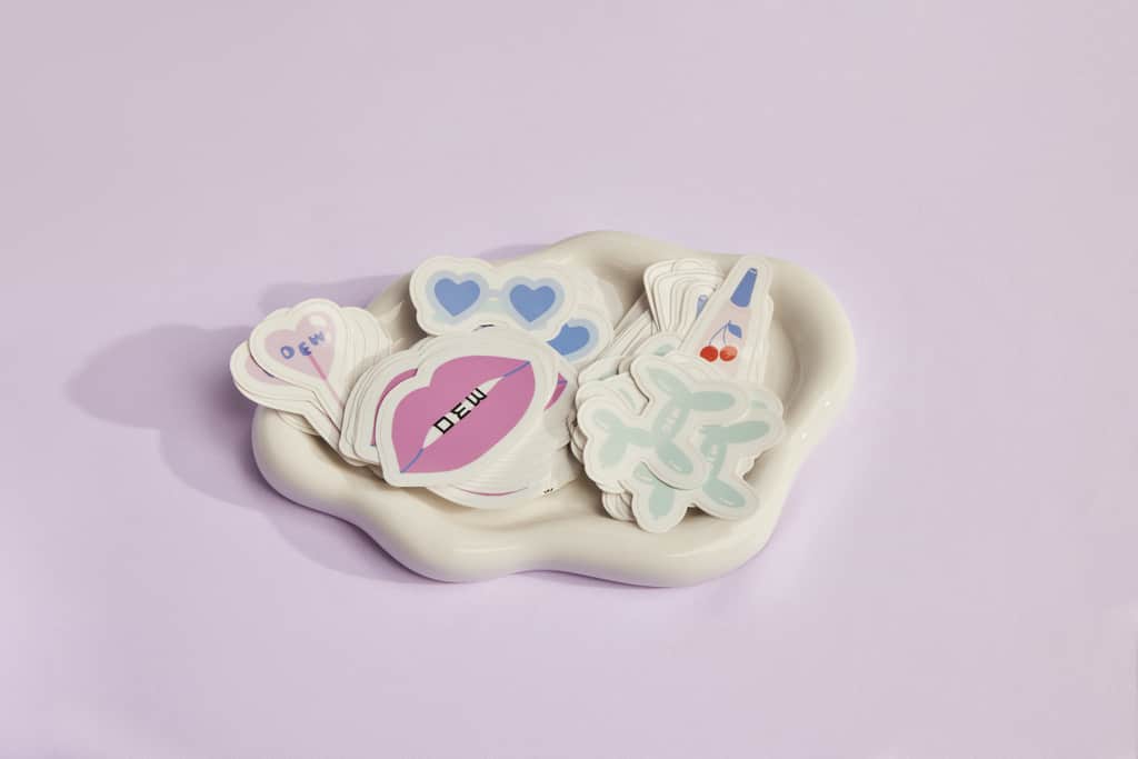 A stack of branded die-cut stickers for campaign use (merch)