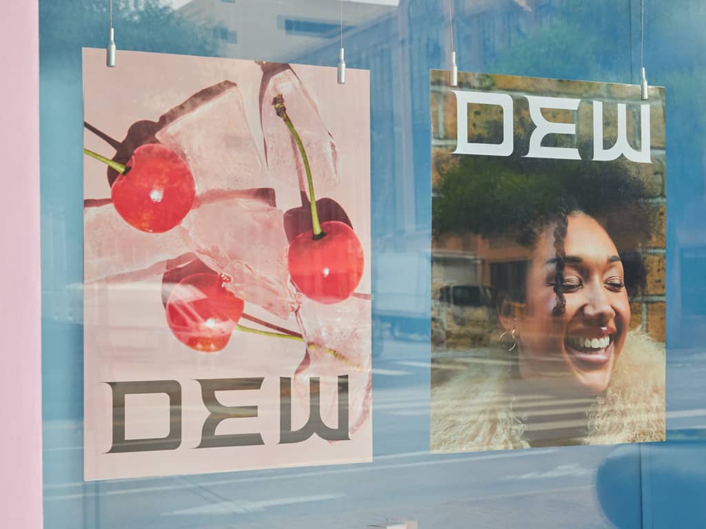 A minimalist poster design featuring the brand name and cherries