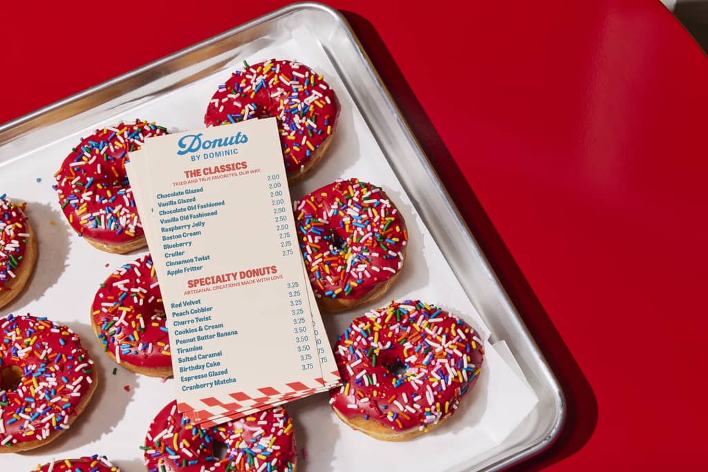 Donut shop menu listing the classics and specialty items with prices