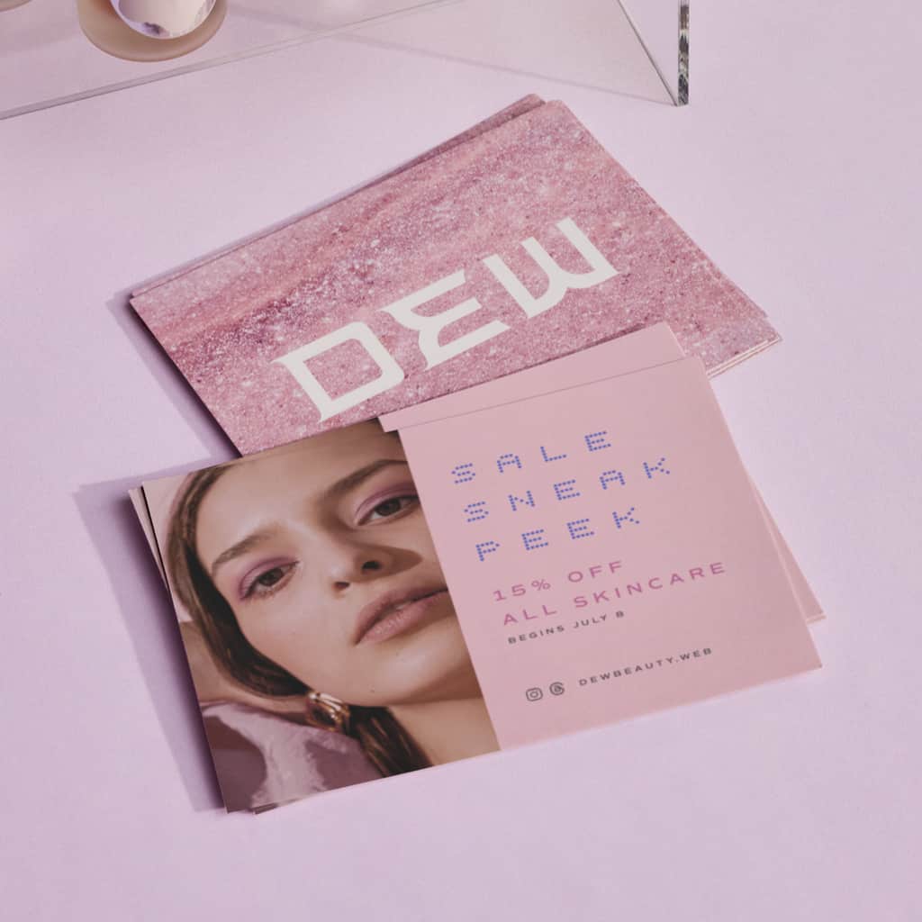 A pink postcard with a unique logo font