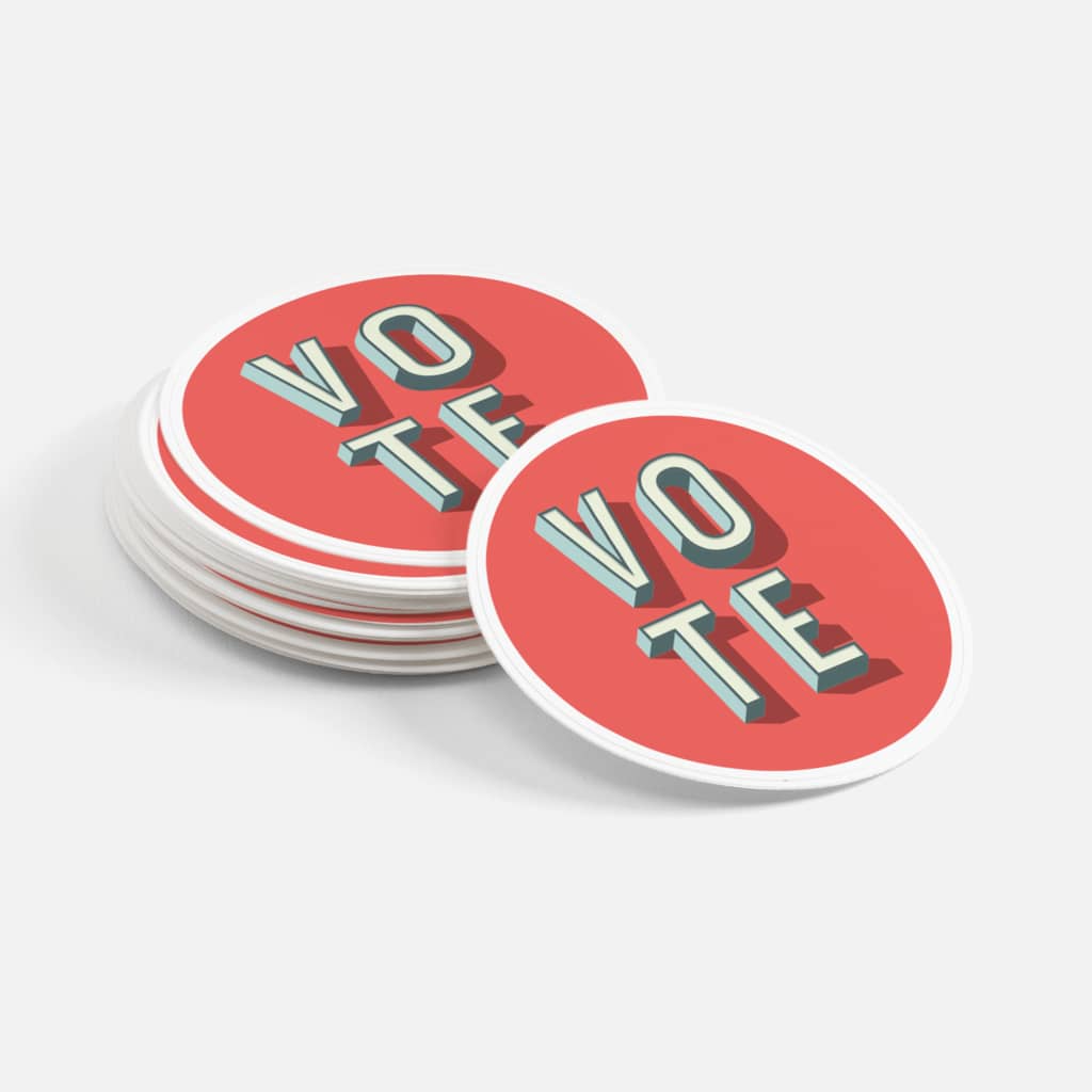 Stack of circular “vote” stickers with red background