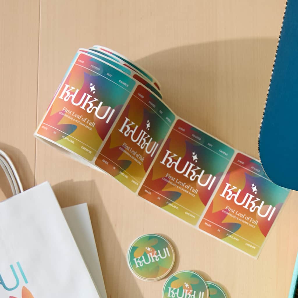 A roll of paper stickers with company branding