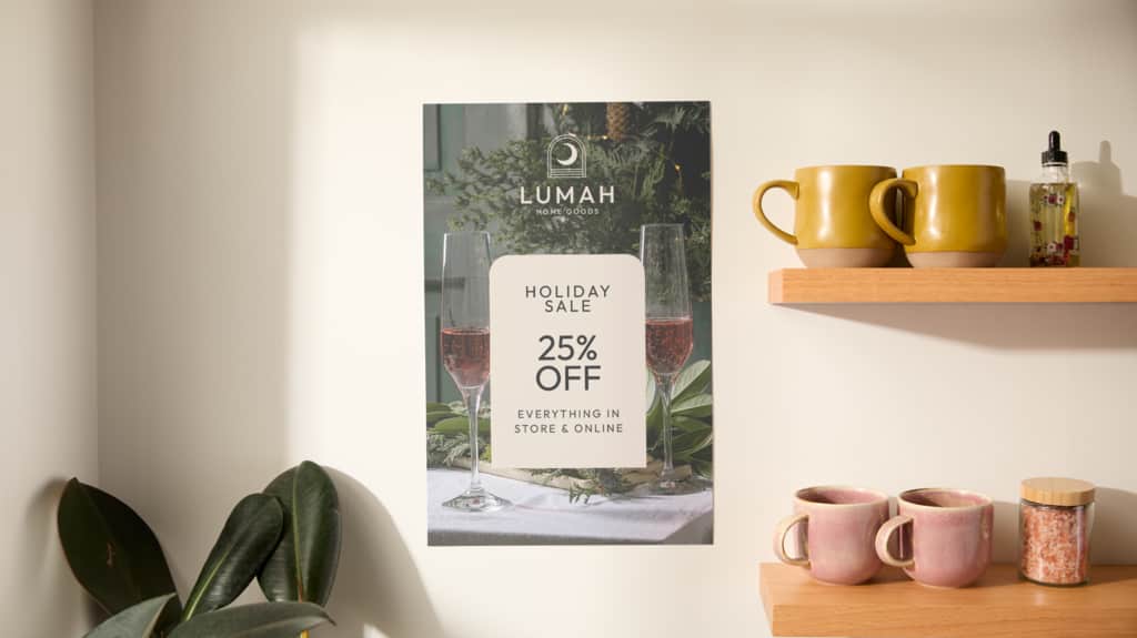 Printed poster promoting a holiday sale offer of 25% off everything in store and online