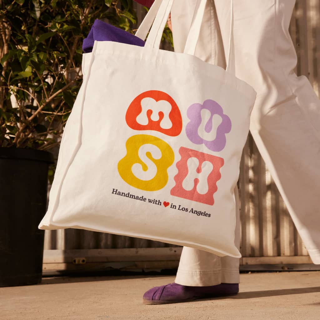 A branded tote bag design with bold typography
