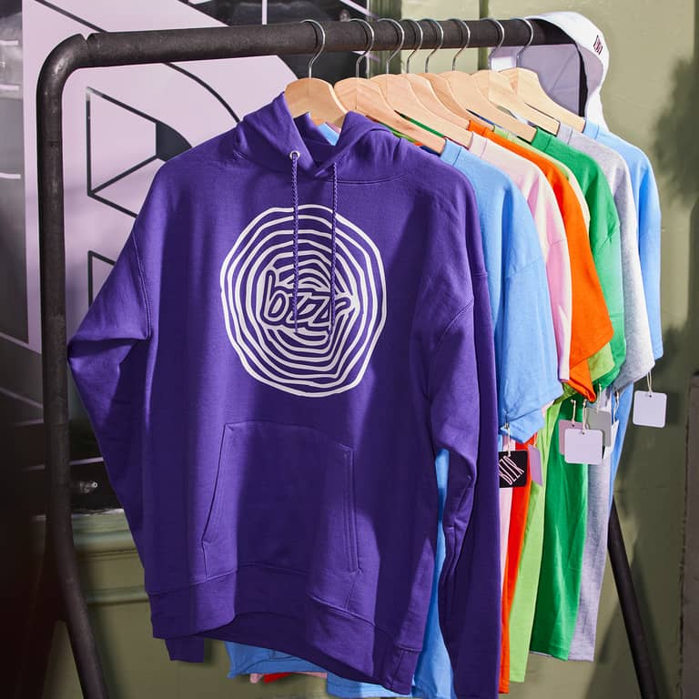 A purple pullover hoodie and branded T-shirts