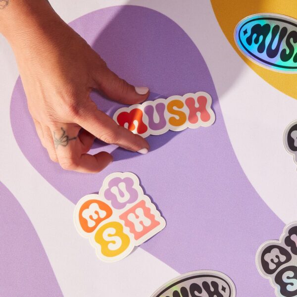 A selection of branded die-cut sticker singles with different shapes and finishes