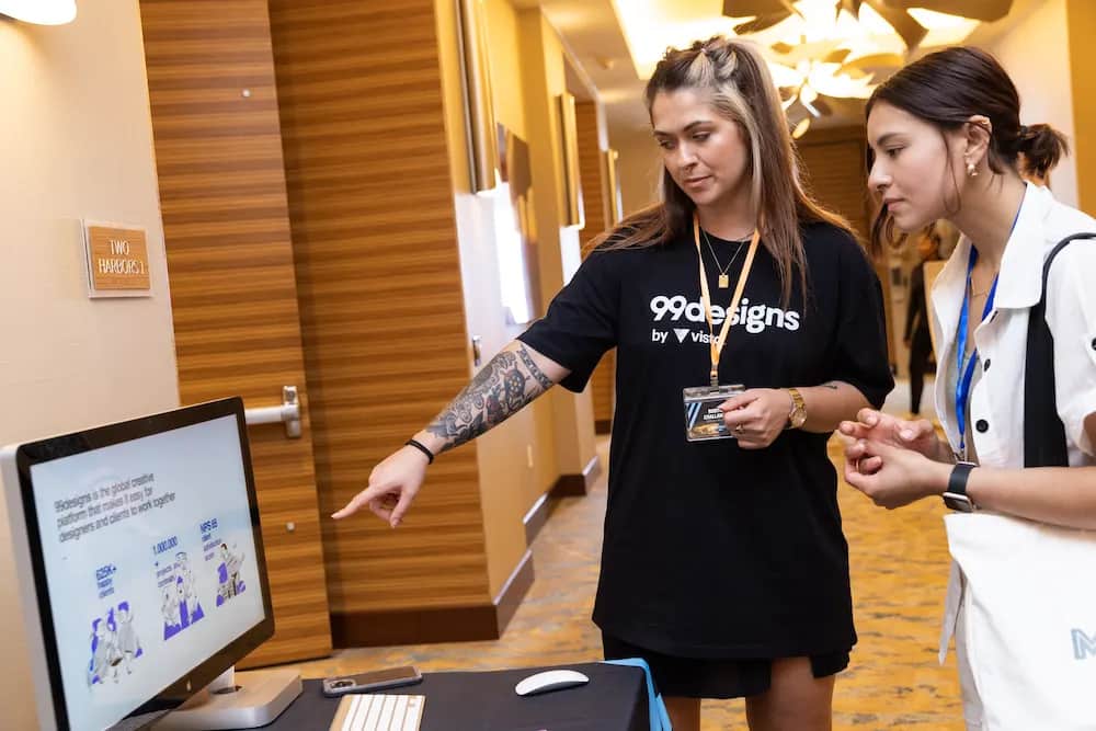 Small business professionals look at a display at a conference