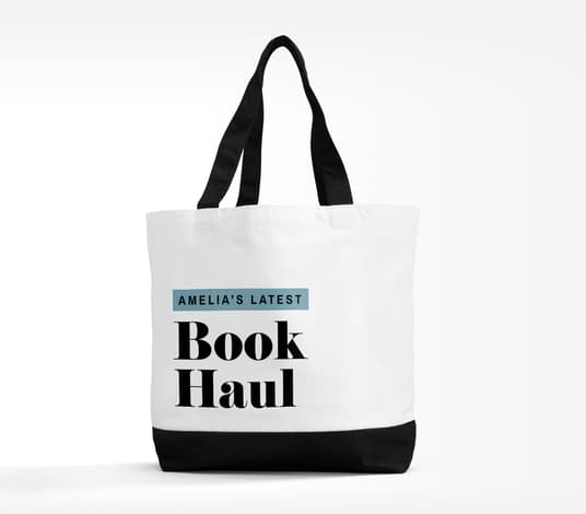 A personalized tote bag with a quote about books