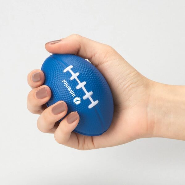 Woman holds blue branded stress football