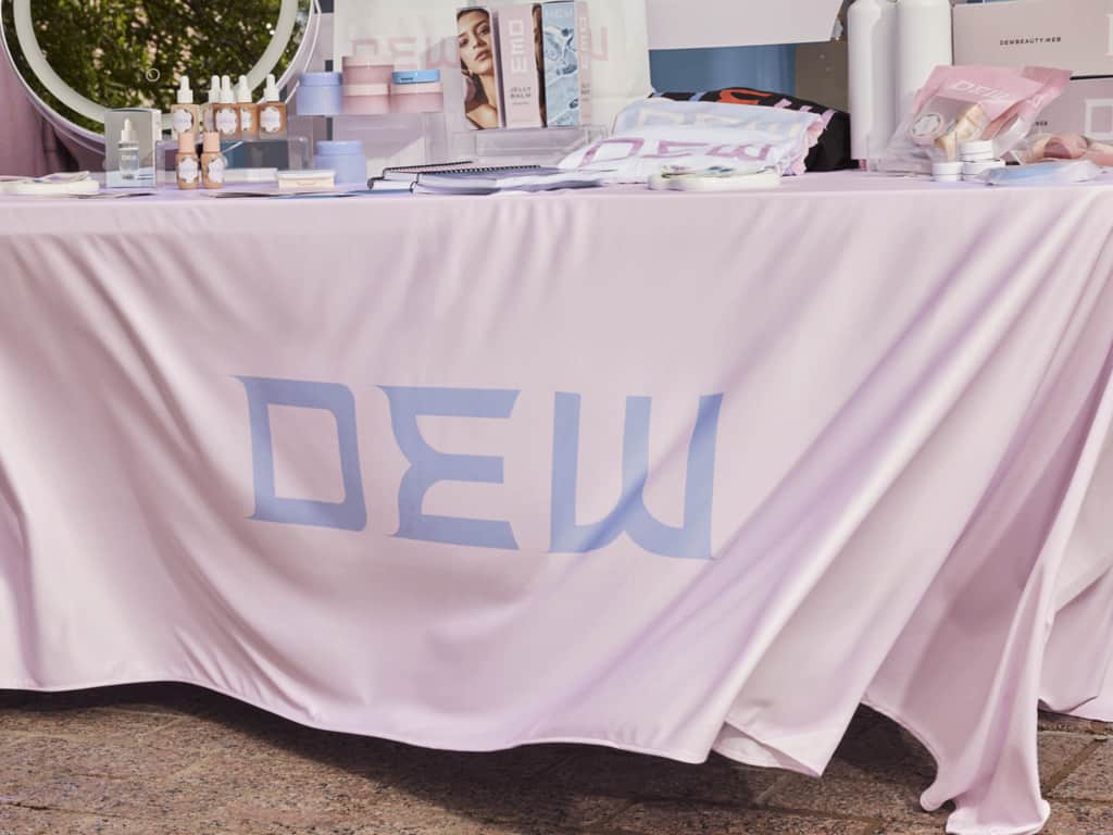 Branded tablecloth set up at an outdoor pop-up shop