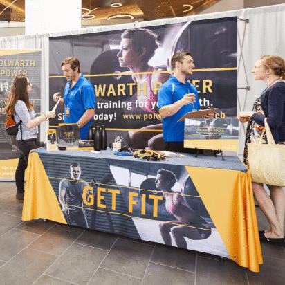 Event registration guide example with trade show booth using signage and materials to engage attendees