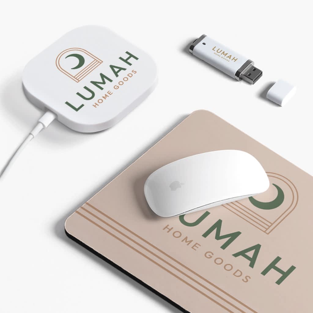 White and pink branded office supplies, mouse mat, pen and USB stick