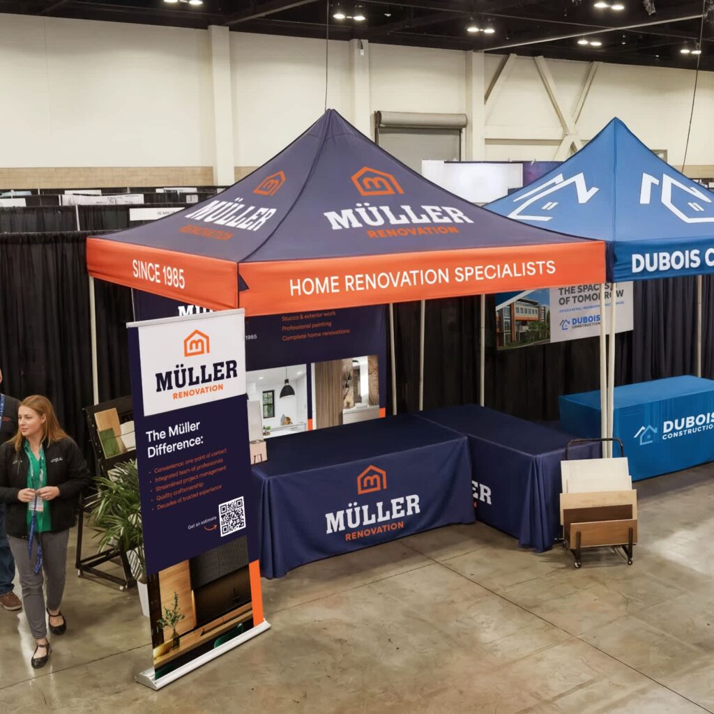 Event marketing trade show booth for a small business with branded canopy and retractable banner featuring a QR code for lead capture