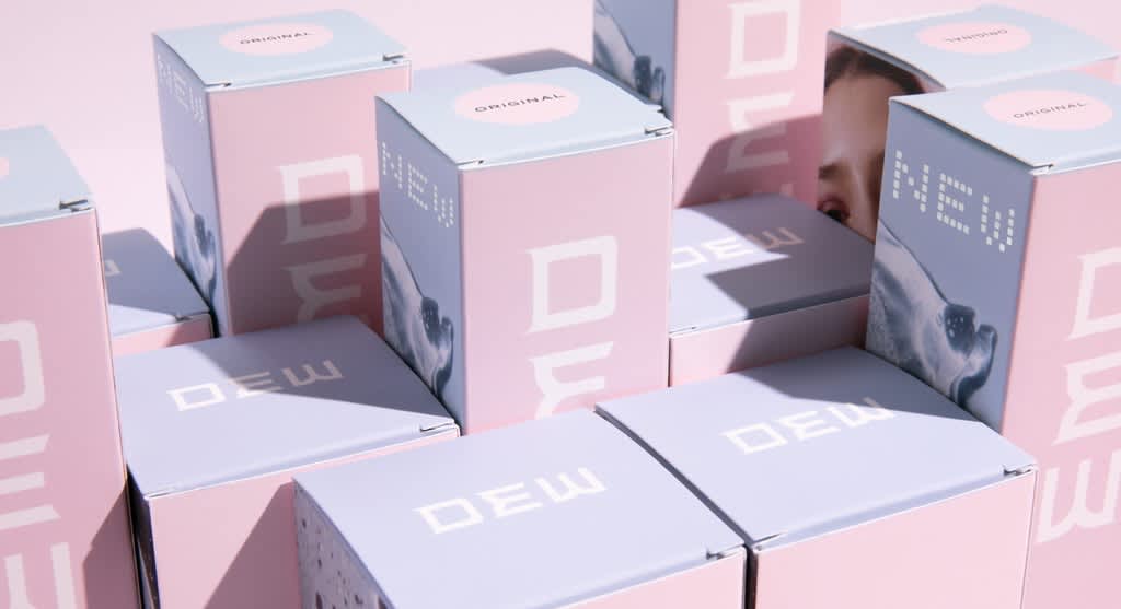 Arange of different sized pink and blue box packaging designs with a white logo for a beauty brand.