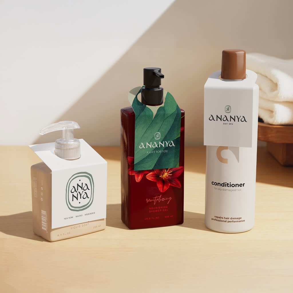 Three bottles with branded tags for a cosmetics brand.