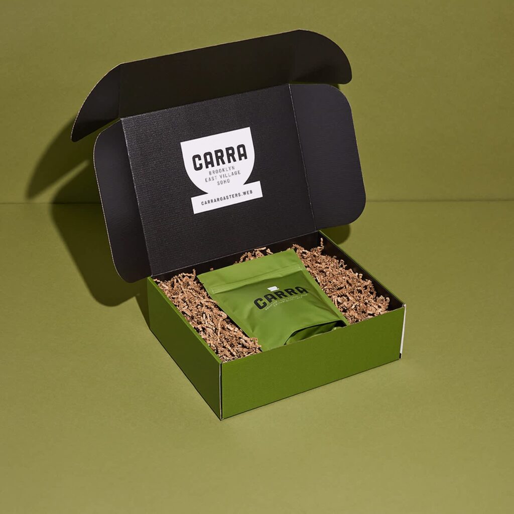 Branded corrugated cardboard mailer box with a plastic standup pouch packaging inside.