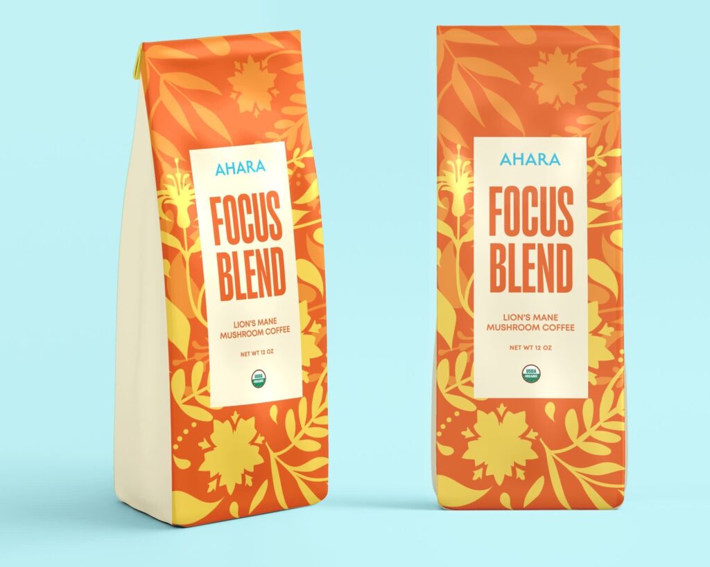 Bright orange coffee packaging bag with bold vertical typography and botanical pattern design for a focus blend product.